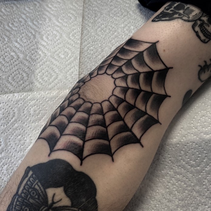 What is the meaning of a spider web tattoo on your elbow  Quora