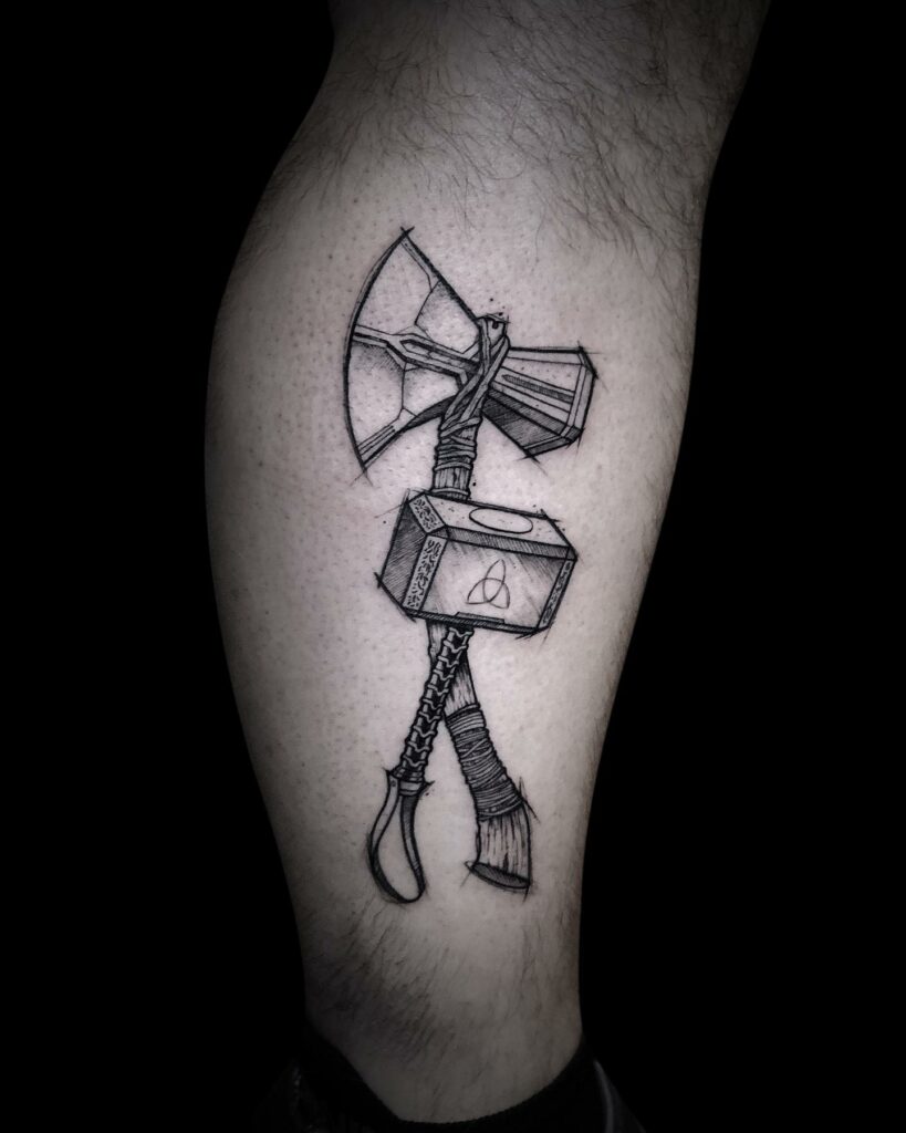 Amazing Ripped Skin Thor Hammer Symbol Tattoo On Man Upper Back