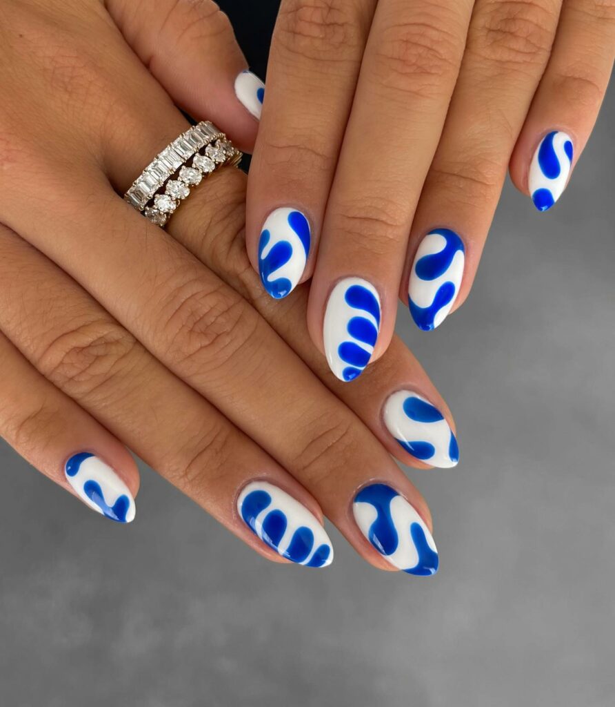 Blue Swirls on White Nails for a Serene Vibe