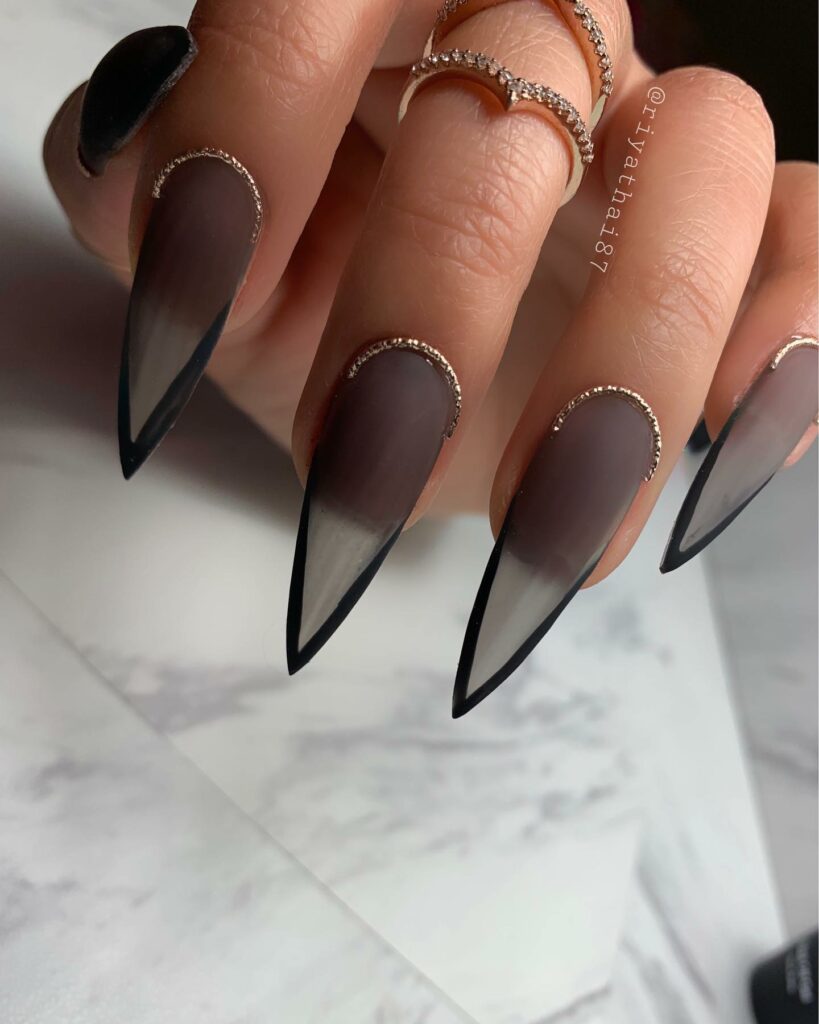 matte black and gold nails stiletto