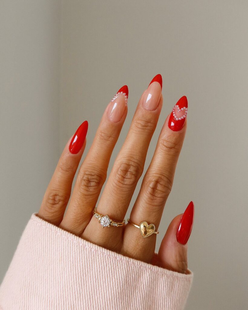 Almond Red Nails with a Singular Heart Accent