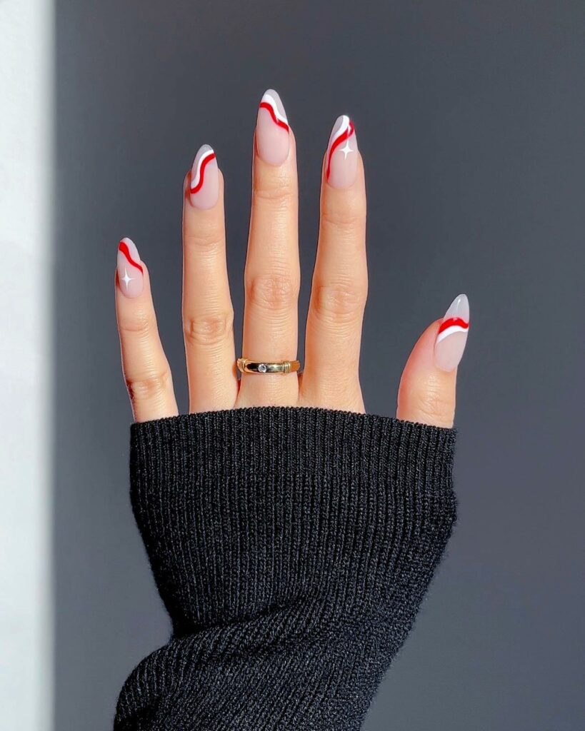 White and Red Swirl on Pink Nails