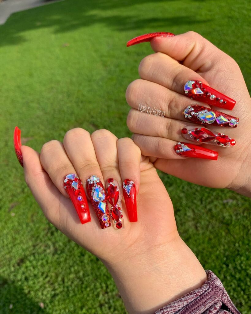 Acrylic Red Nails Adorned with Rhinestones