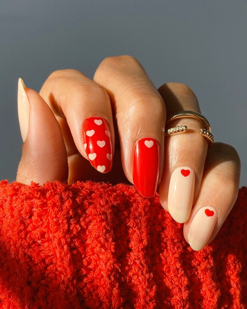 Almond Red Nails with Heart Motifs