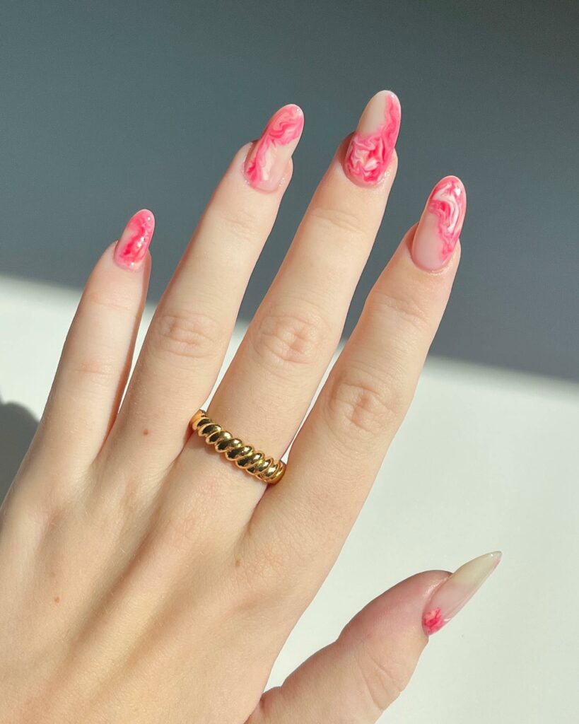 Marbled Red and Pink Nails with Swirling Elegance