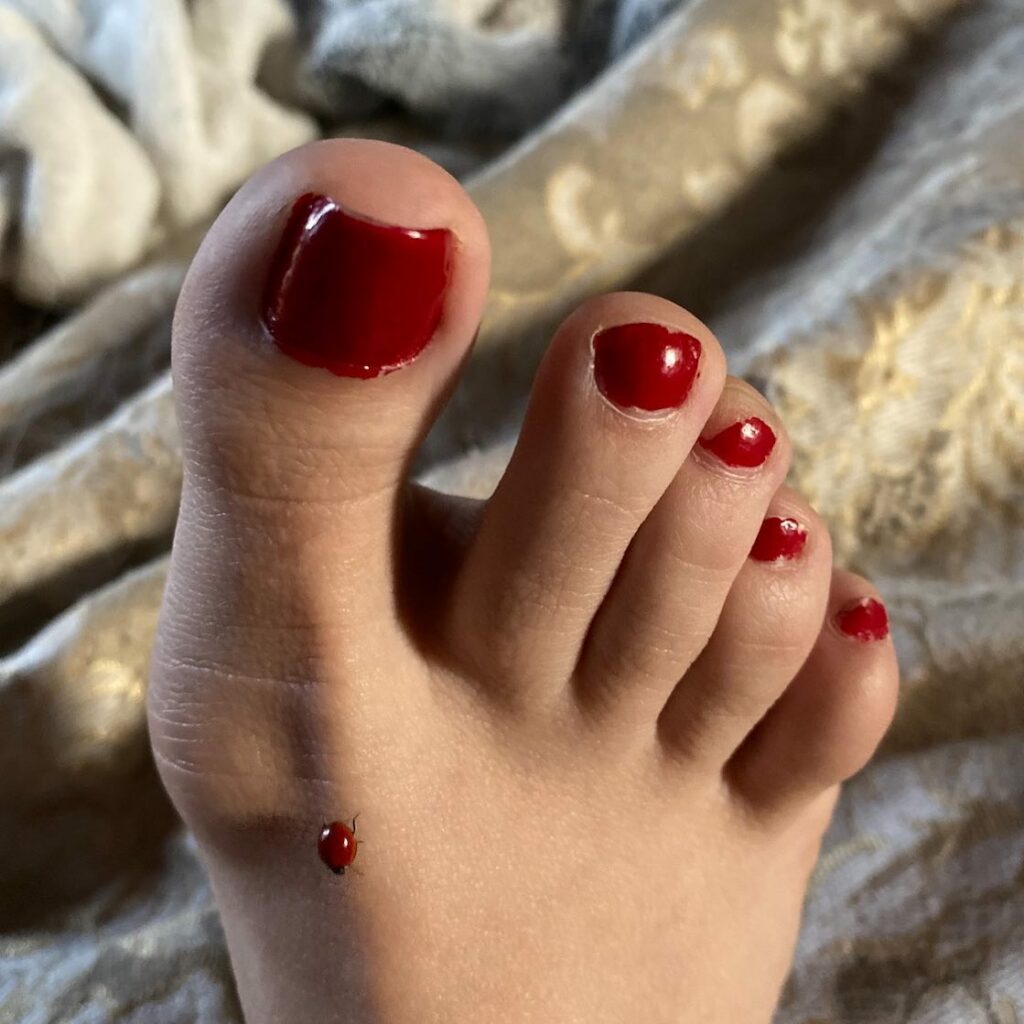 Blood-Red Pedicure with a Golden Twinkle