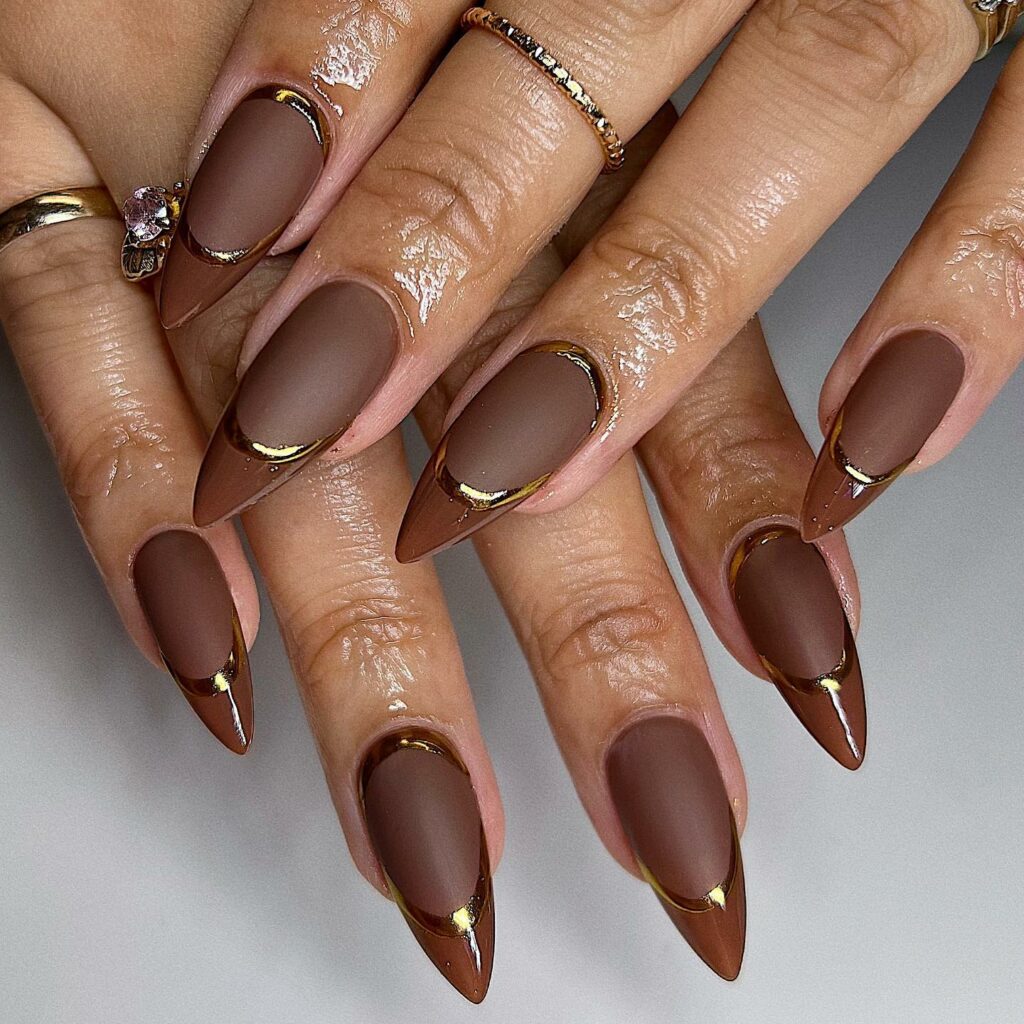 Elegant Brown Stiletto Nails with Golden Flair