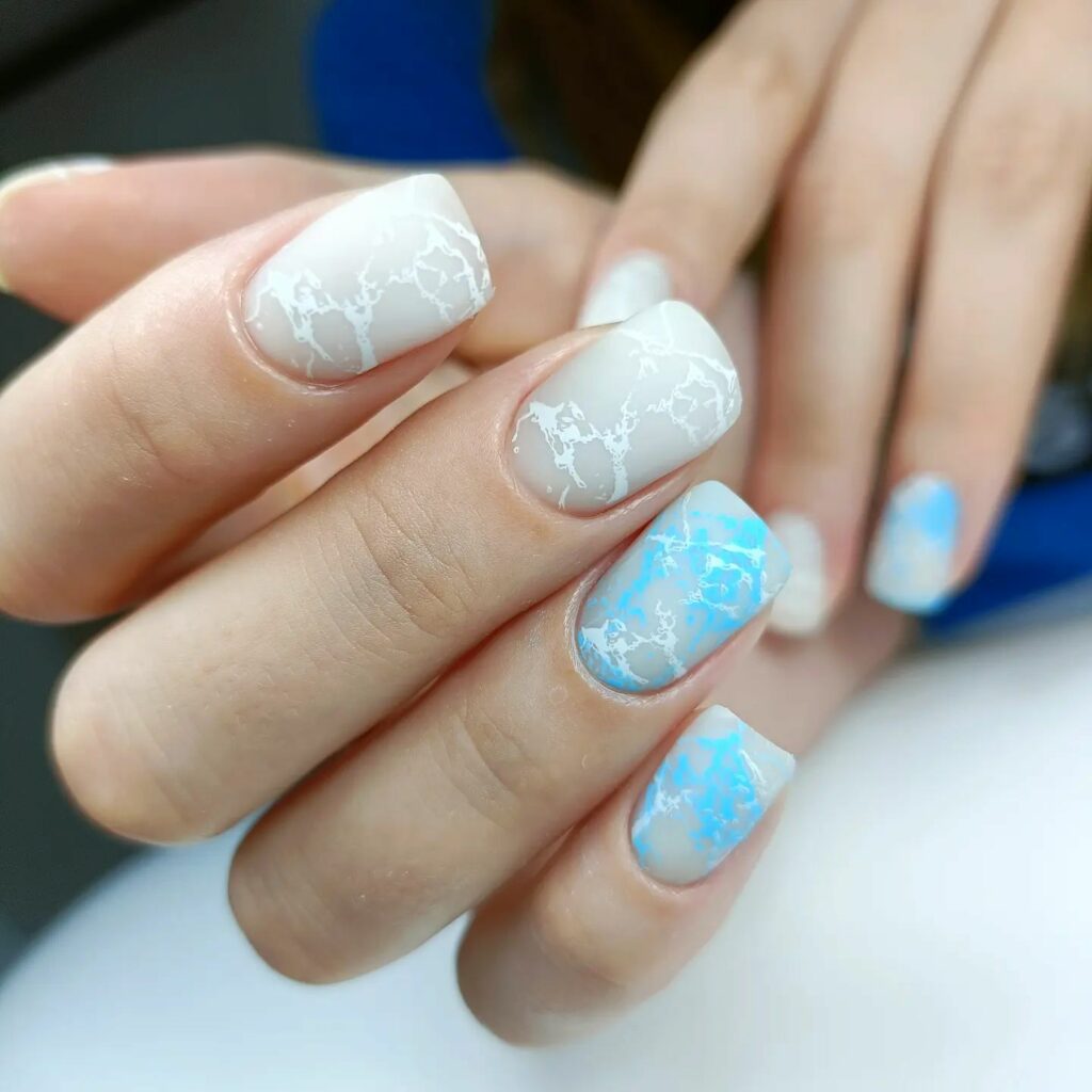 pastel blue tones marble nails