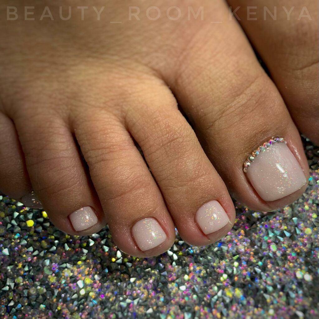 Nude Color Pedicure With Glitters On Base