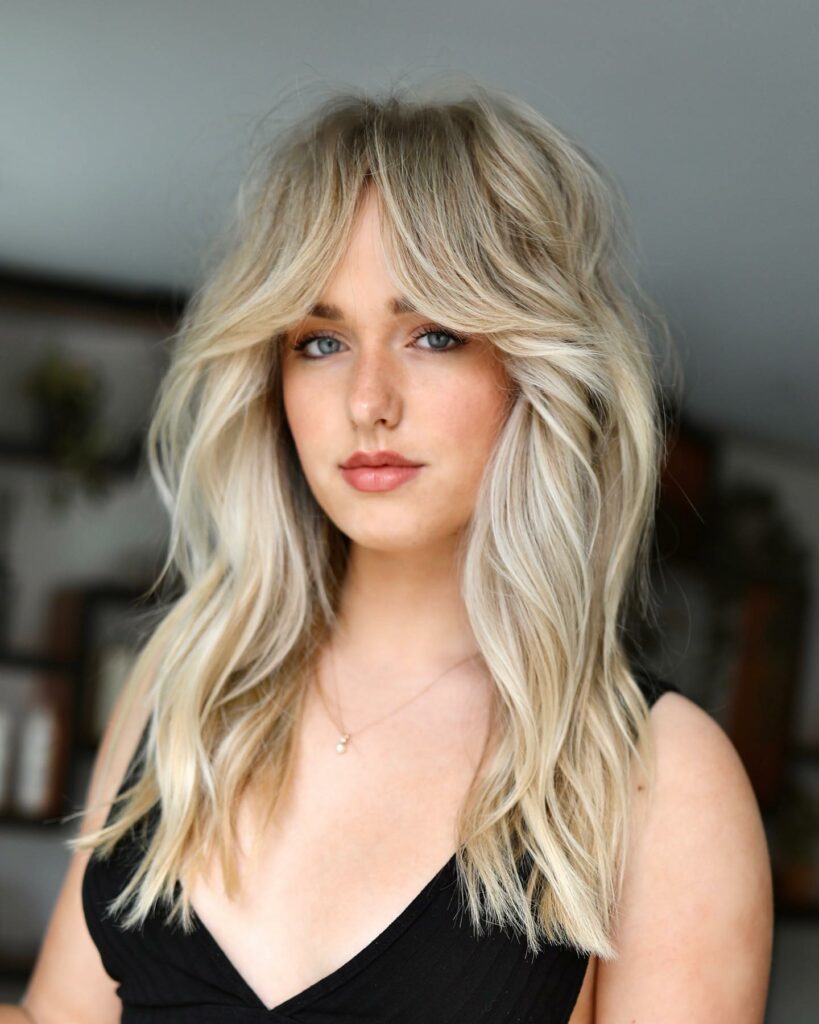 Long Hair with Highlights and Curtain Bangs