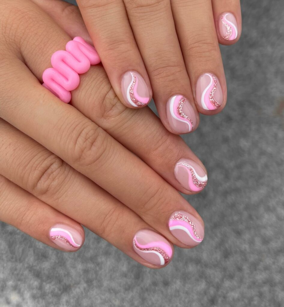 Pink Nails with Glitter And Swirls