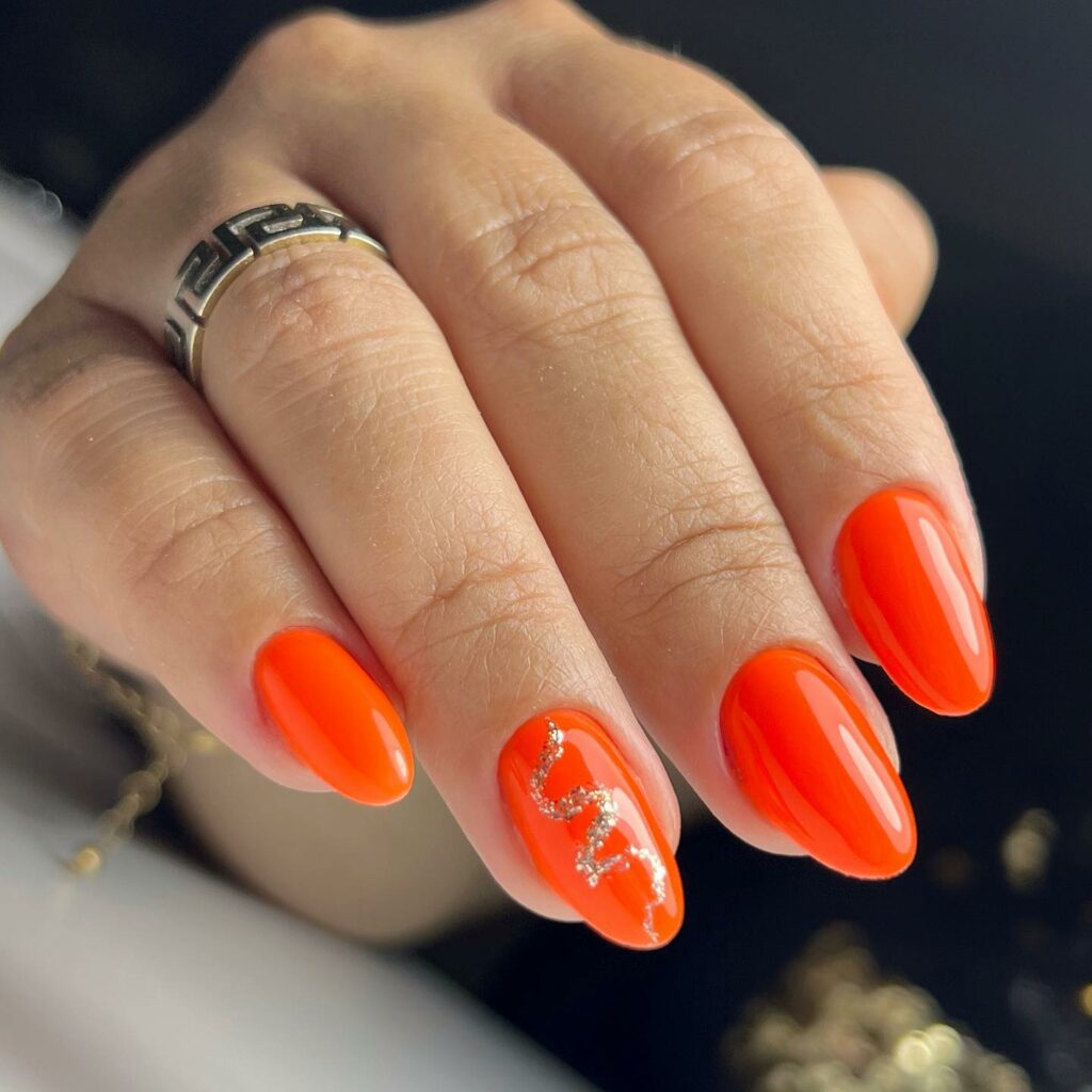 Glam Orange Nails With Gold Foil