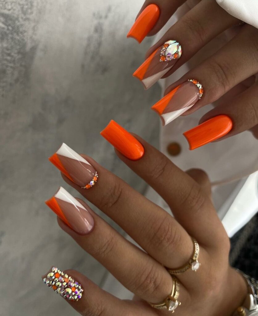 Bold Orange Nails With Rhinestones