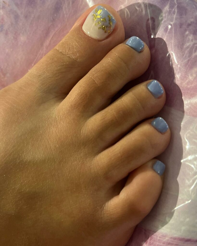 Light Blue Pedicure With Gold Dust Design