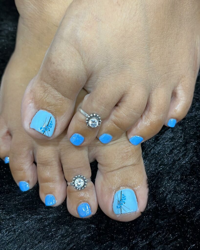 Light Blue With A Blue Flower Design