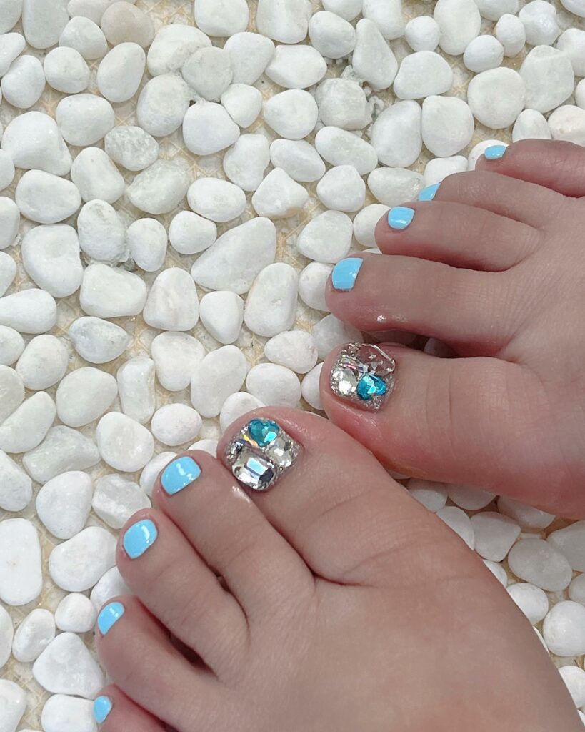 Light Blue Pedicure With Gold Stones