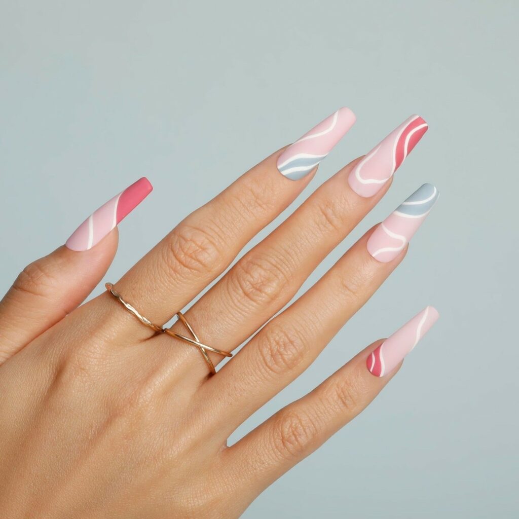 Matte Pink Nails with White Swirls