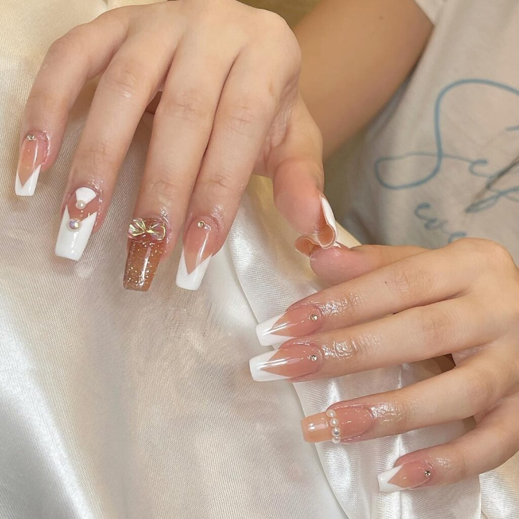 White V Cut French Tip Nails With Gold Glitter