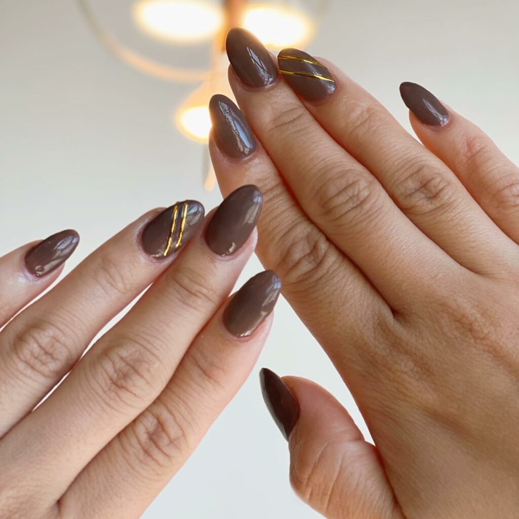 Dark Beige Nails With Gold Accents