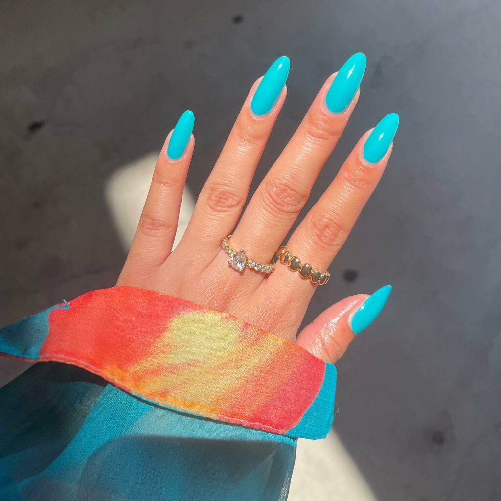 Sleek and Chic Almond Teal Nails