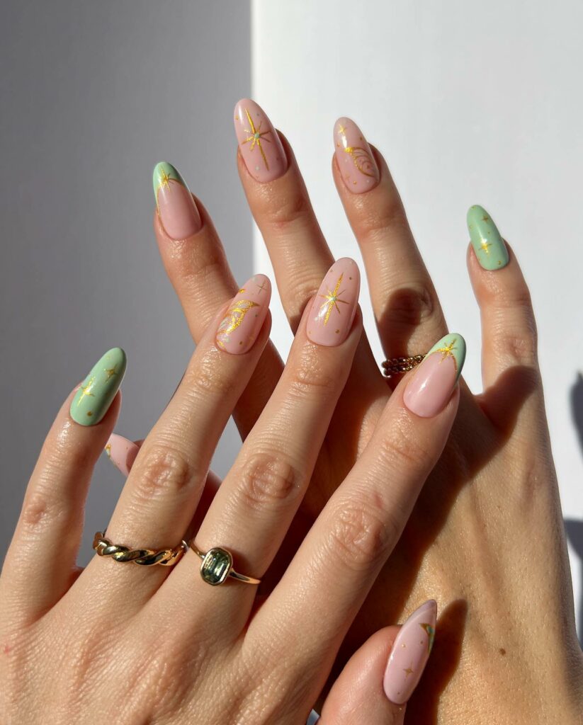 Gold Star Decorations on Light Green Nails