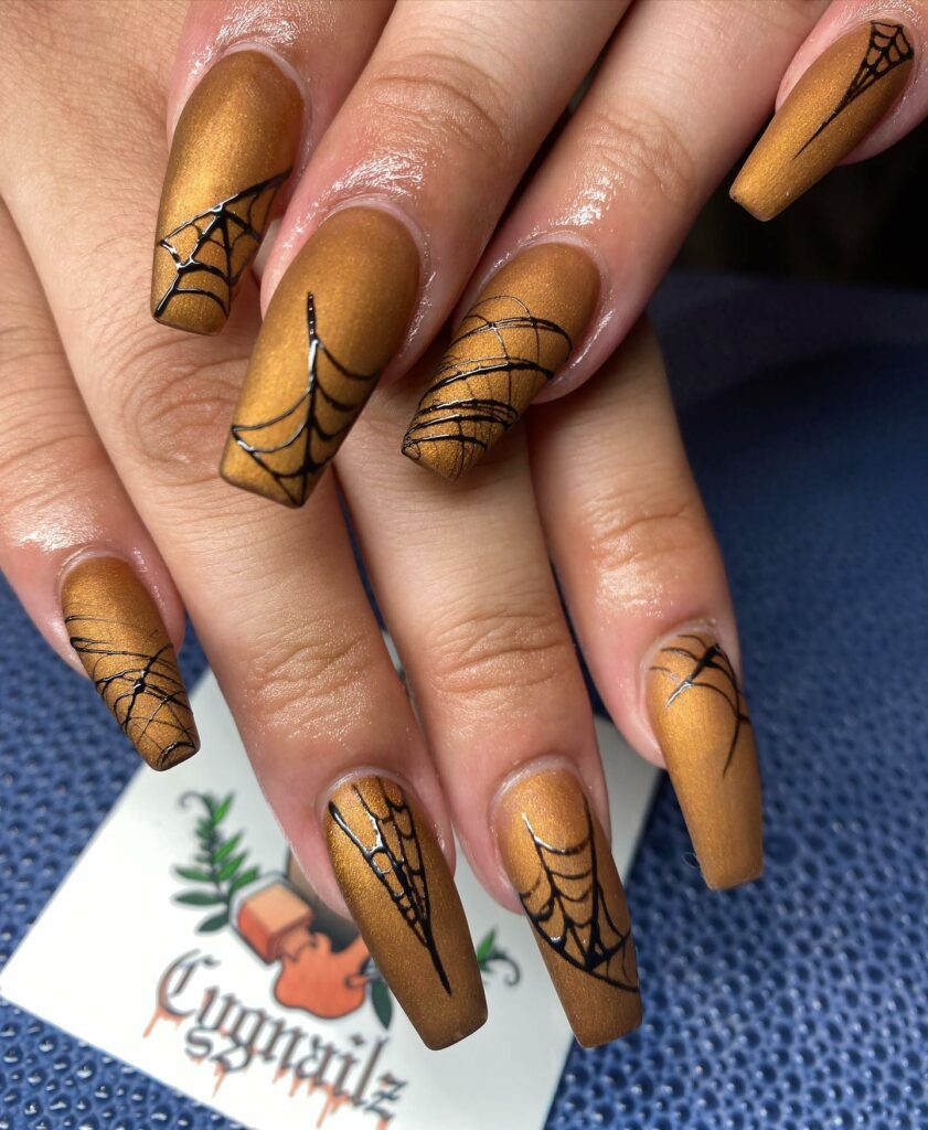 Golden spider web nails