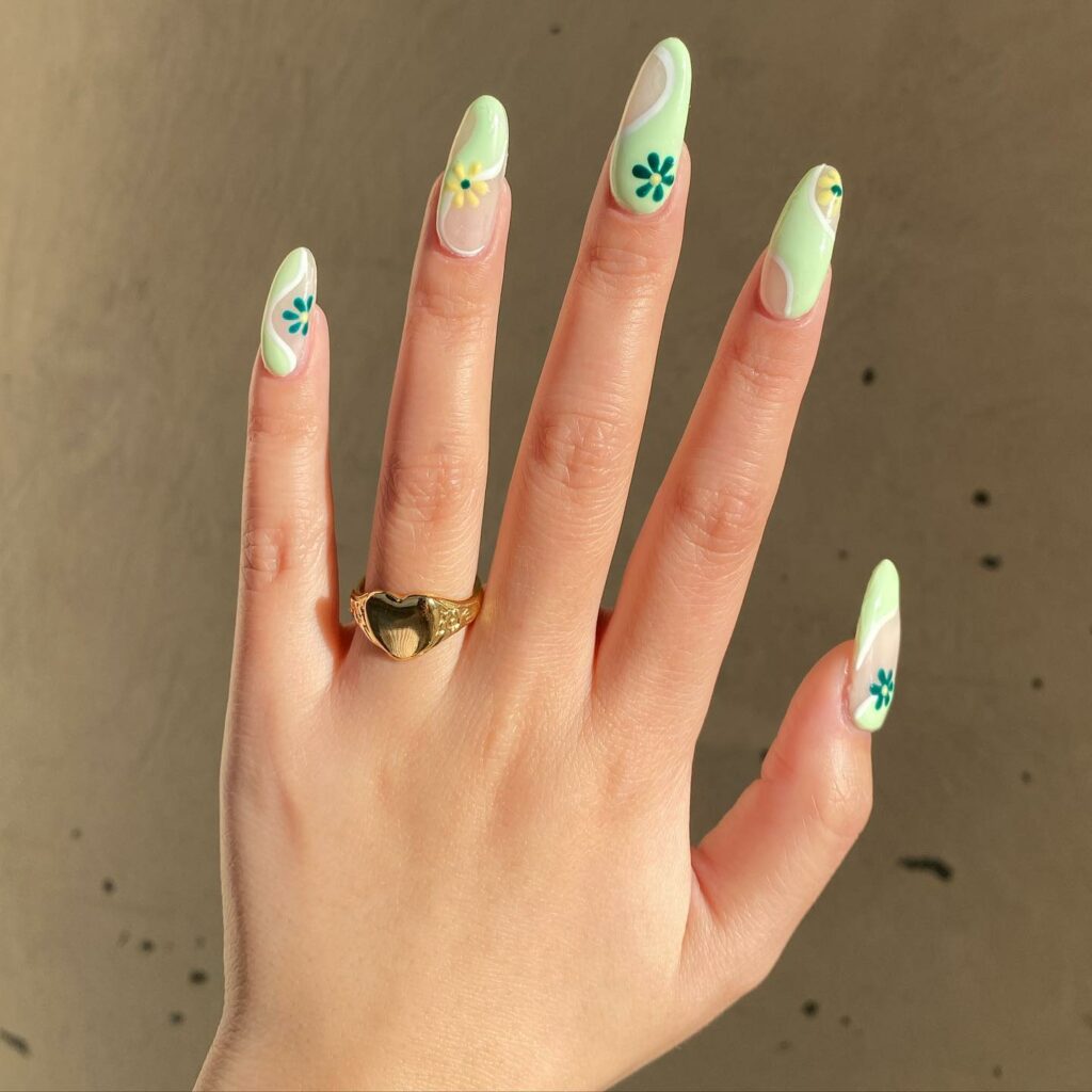 Blossoming Floral Designs on Light Green Nails
