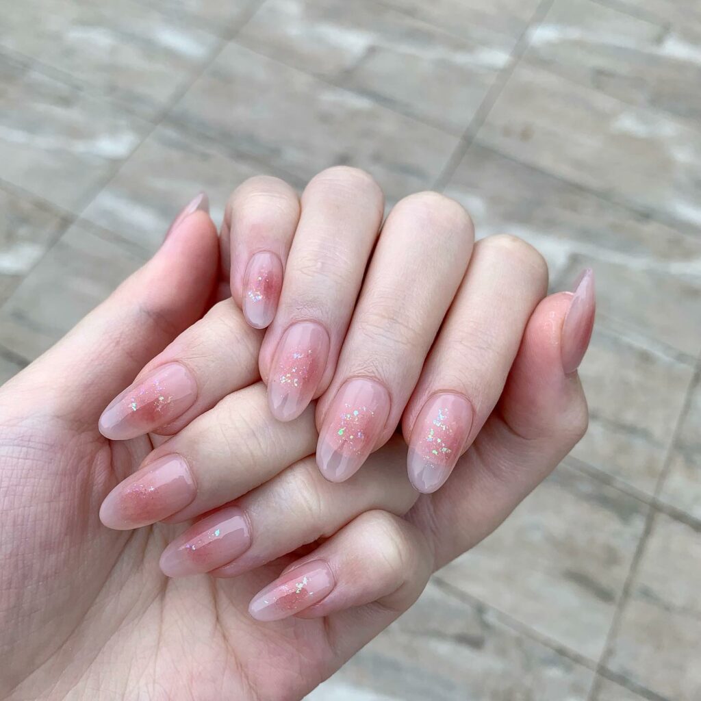 Sparkling Baby Pink Nails with Subtle Glitz