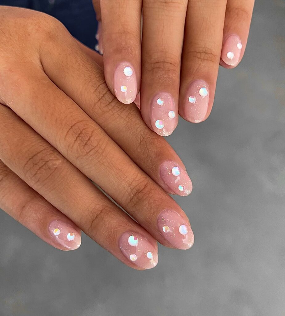 The Allure of Gems on Nude Pink Nails