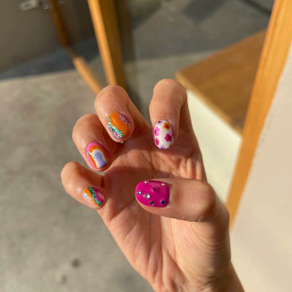 Colorful February Nails With Glitter, Swirl And Flowers