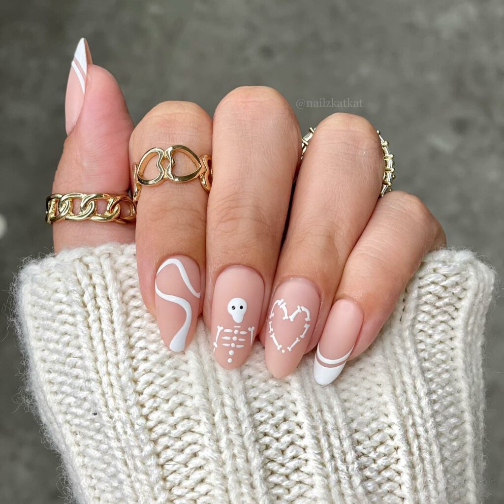 Matte Nude And White Nails With Skeleton, Heart And Swirl