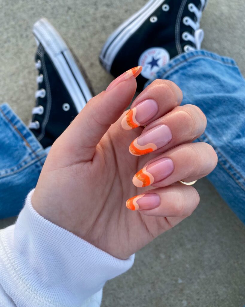 Two Color Orange French Tip Nails With Glitters