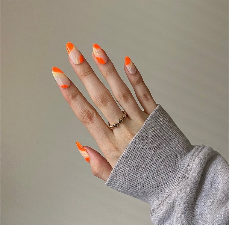 Almond Orange French Tip Nails With Abstract Design