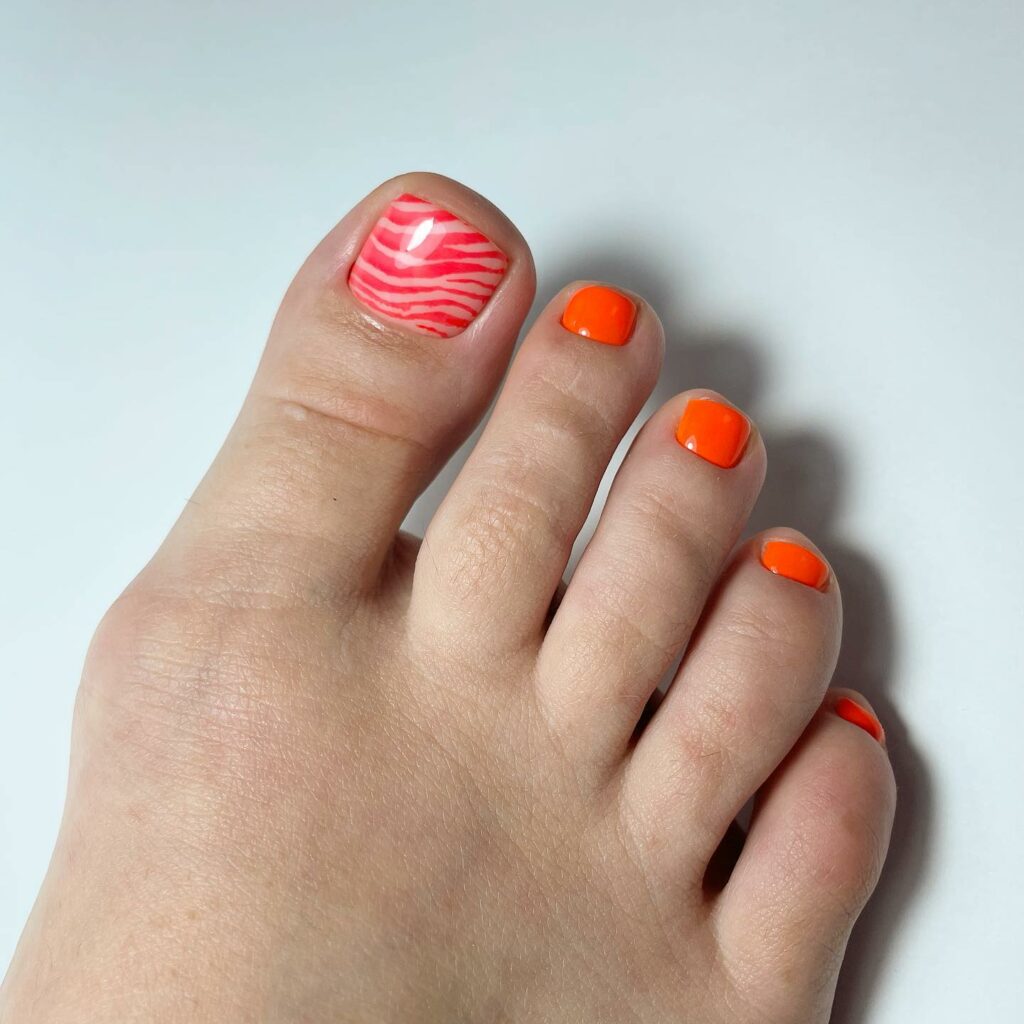 Orange Accent Pedicure With Red Pattern