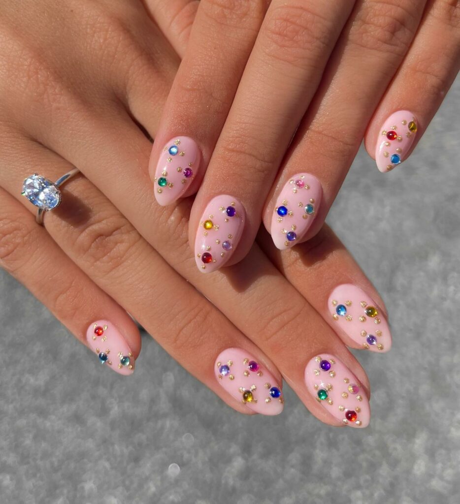 Almond Short Pink Nails Adorned with Colorful Stones