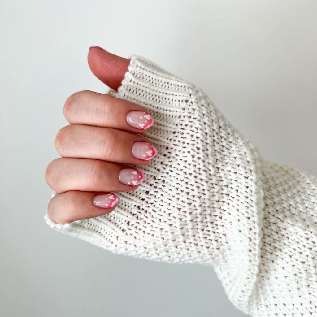 Pink French February Nails With White Hearts