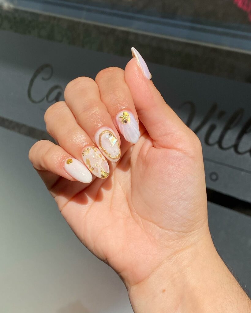 Tanya Inspires on X: White nails with gold flakes   #nailart #naildesign #nailflakes #nails #whitenails #manicure   / X