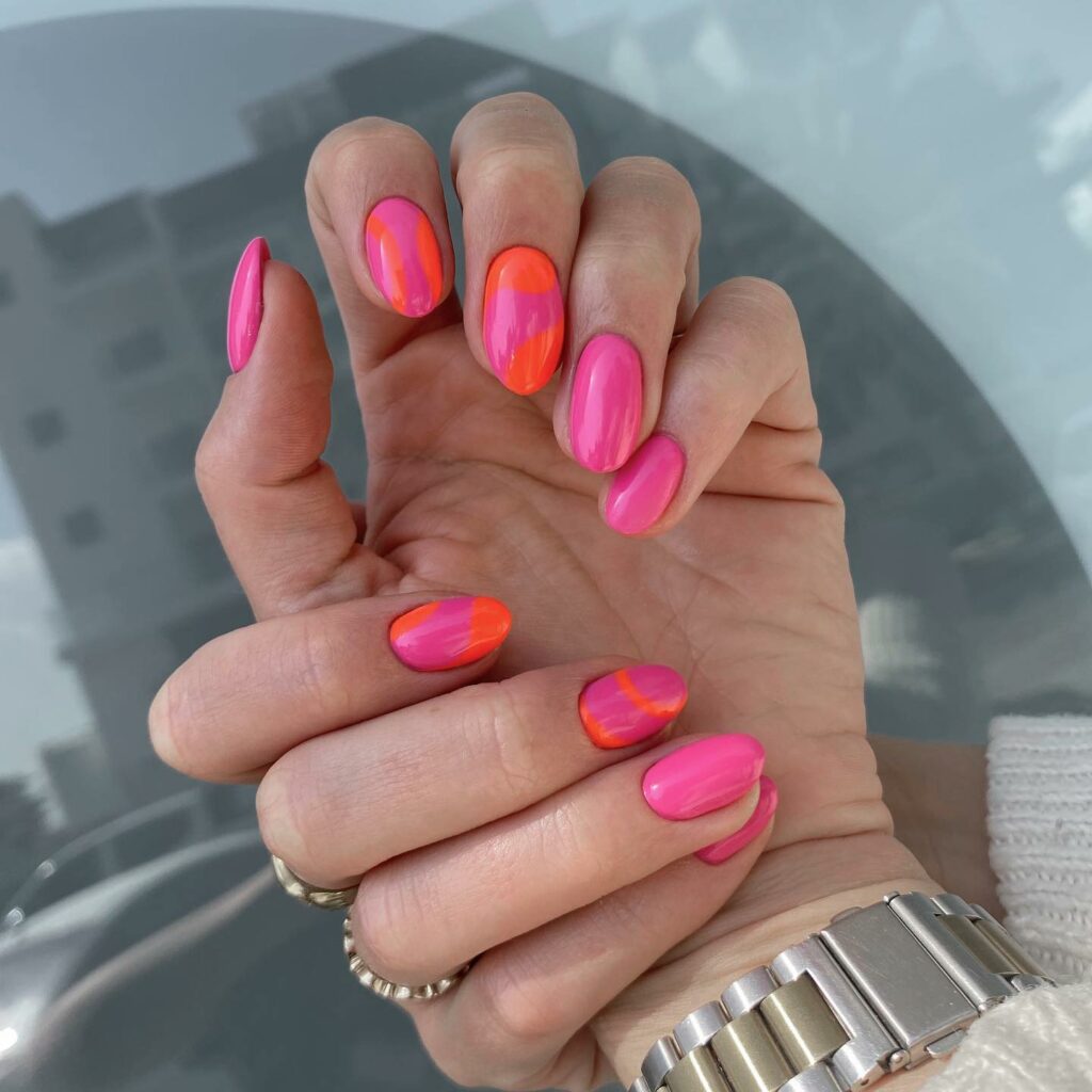 Almond Short Pink Nails with Orange Swirl Designs