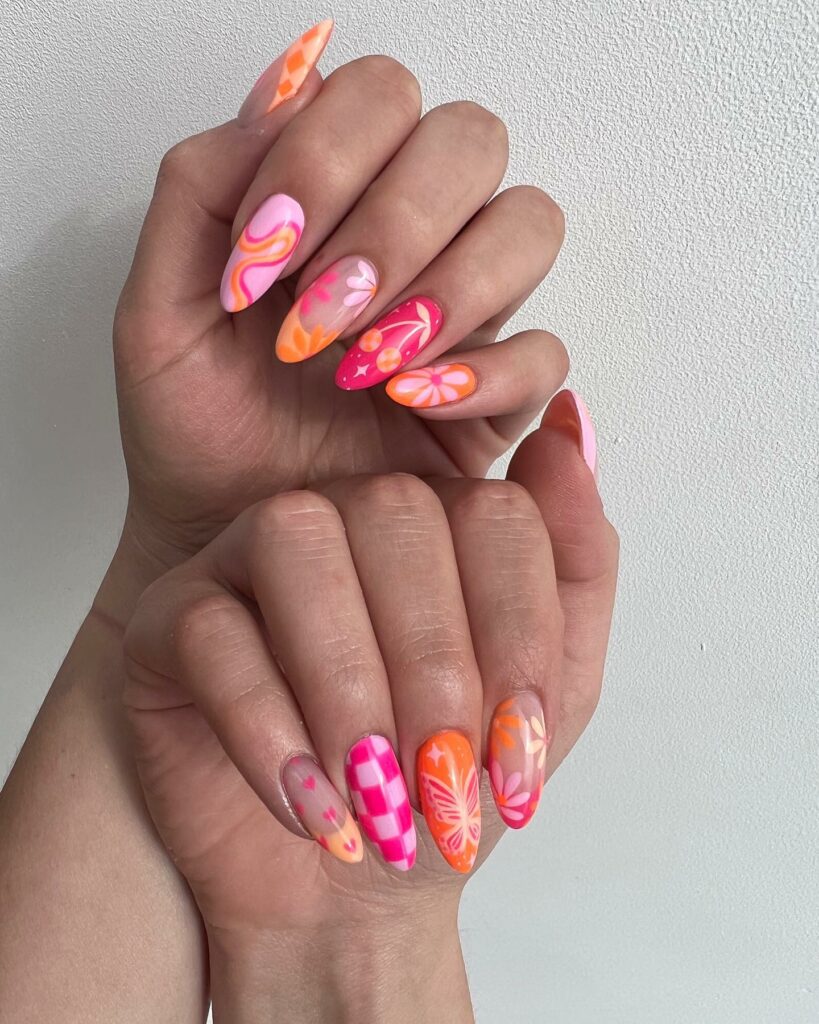 Pink And Orange Nails With Checkered And Daises Design