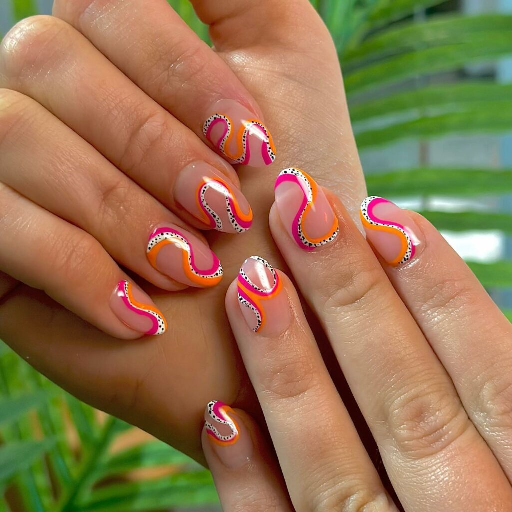 Small Pink And Orange Nails With Swirls And Dots