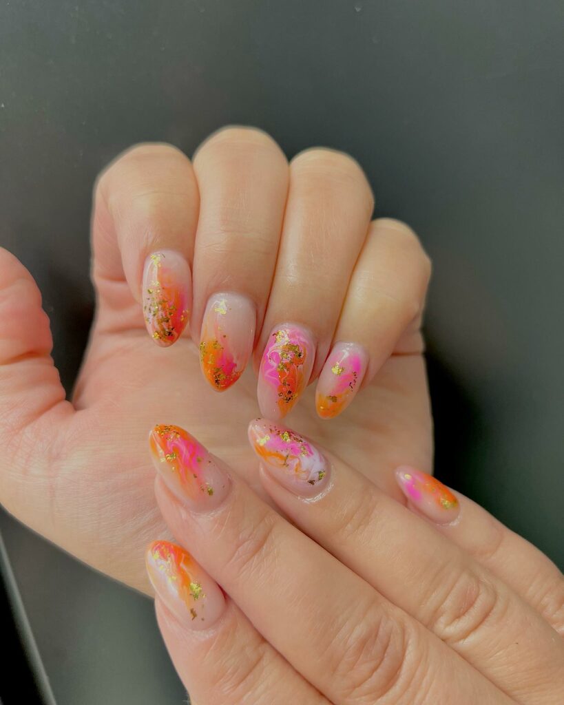 Pink And Orange Marble Nails With Gold Flakes