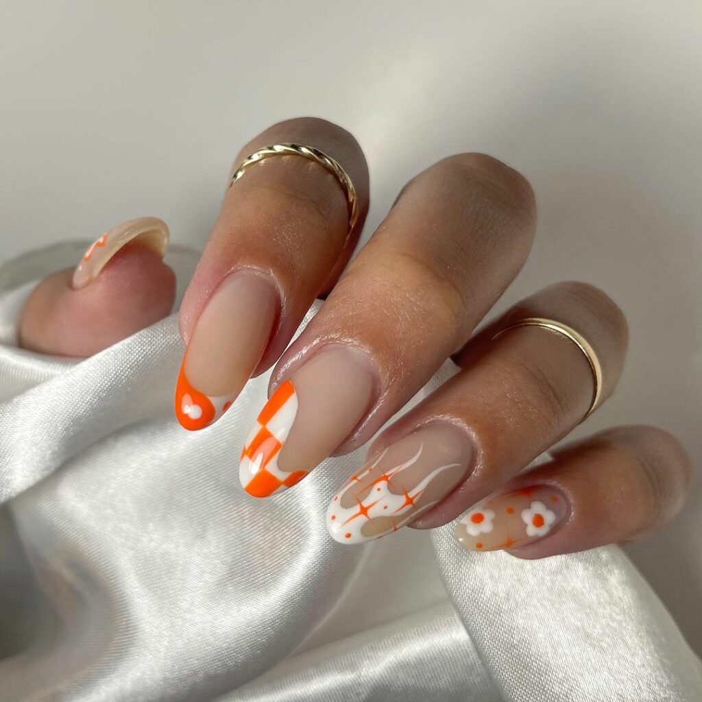 Orange And White French Nails With Flame And Daises Design