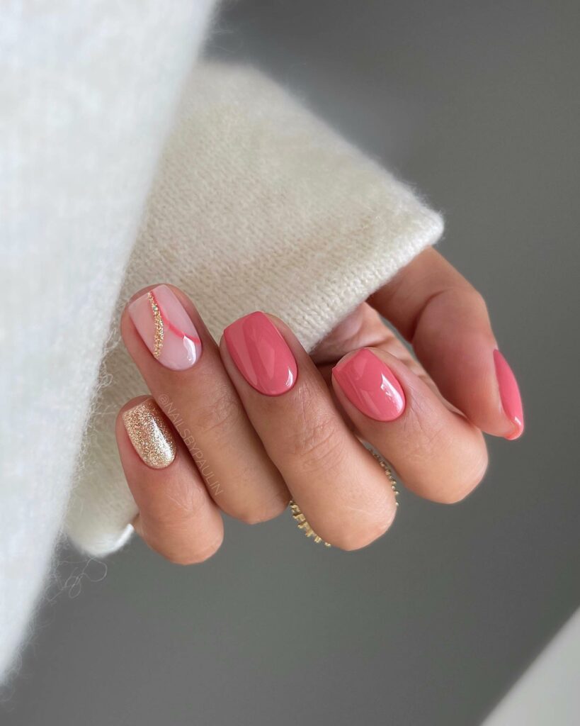 Glossy Pink Short Nails with Gold Glitters
