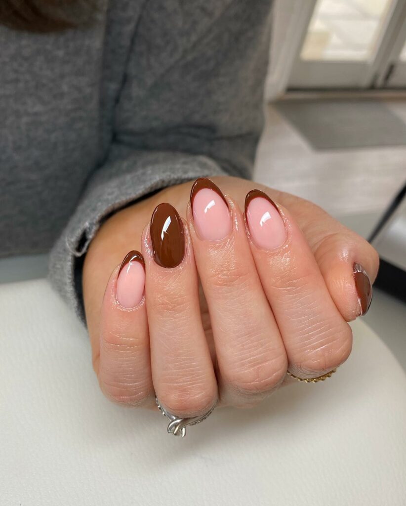 Brown French Tips On A Clear Pink Base Nail