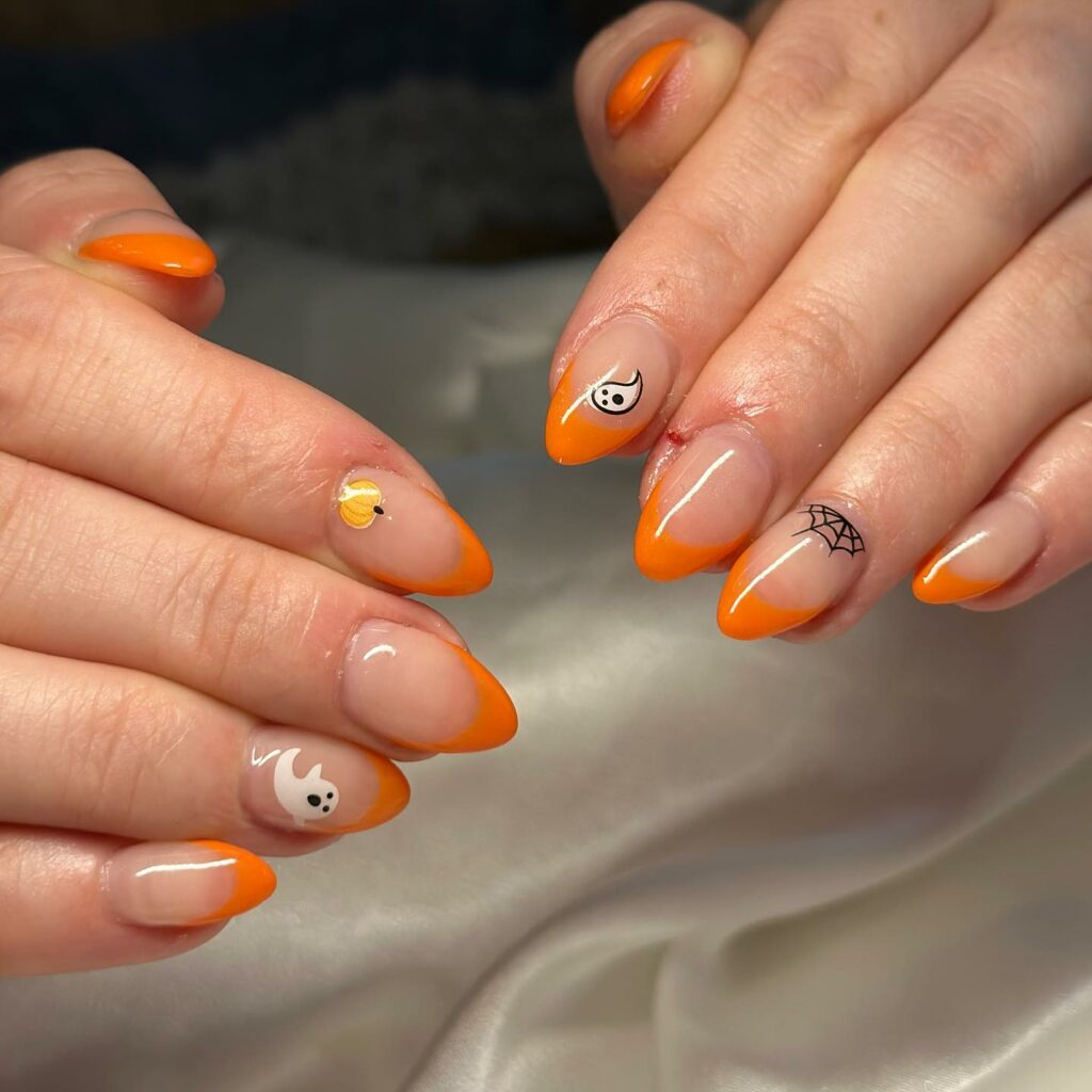 Orange French Tip Nails With Ghost, Pumpkin, And Spider Web Design