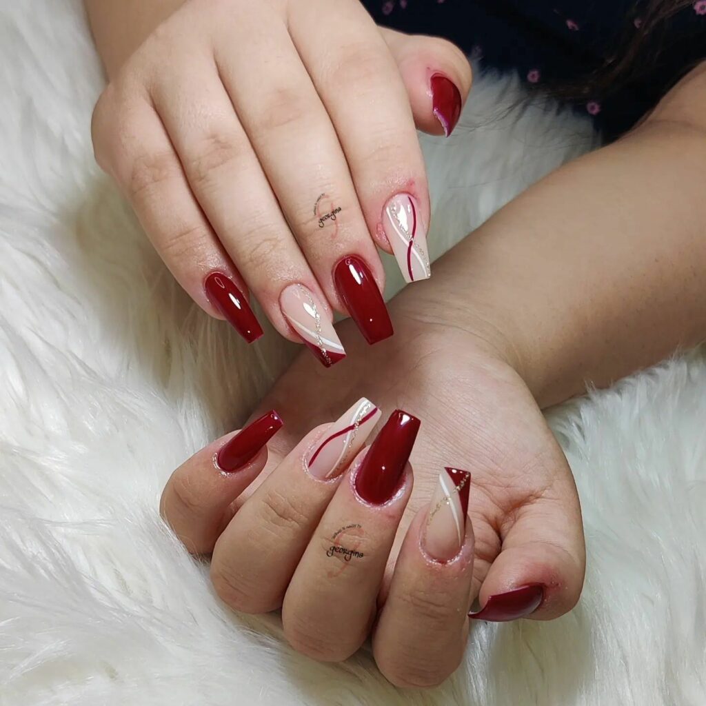 Side French Tip On Red Coffin Nail With Swirls
