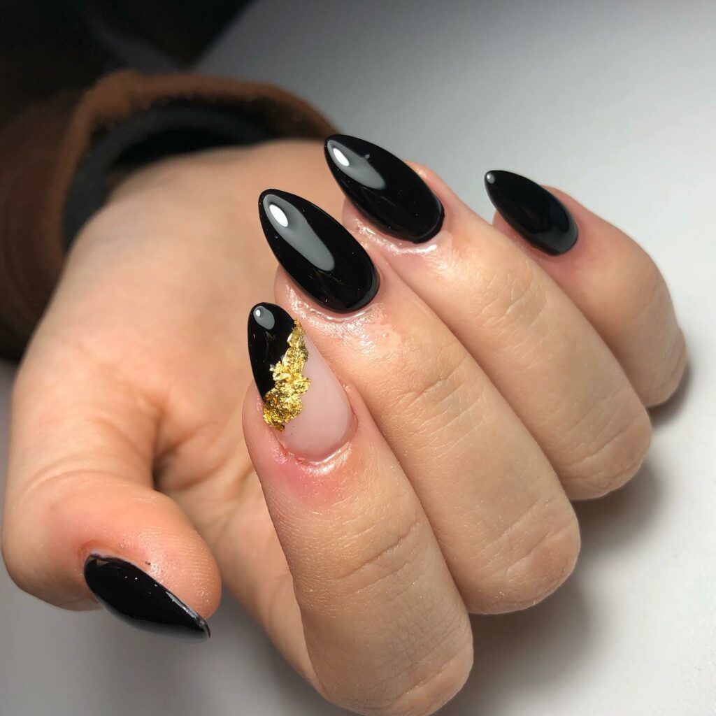 Luxurious Black Almond Nails and Gold Foils