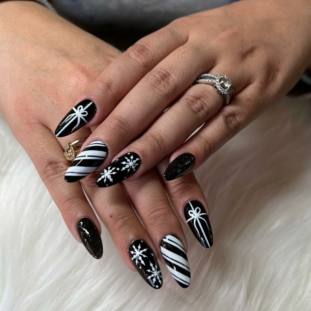 Black Almond Shaped Nails with Snowflakes