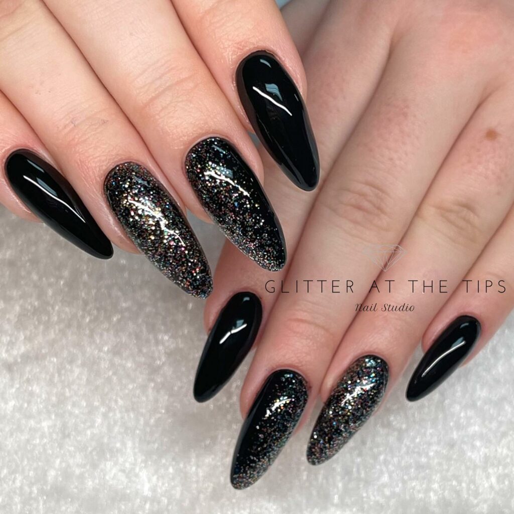 Sparkling Nights with Black Glitter Almond Nails
