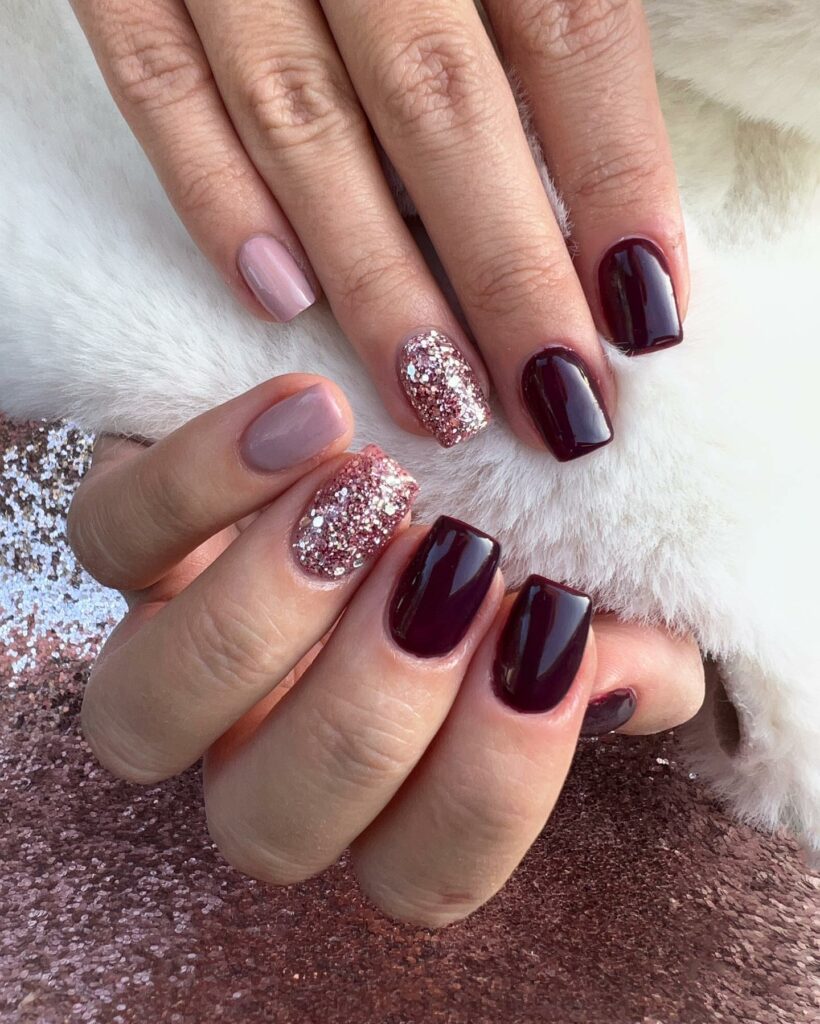 Burgundy and Glittery Gold Nails